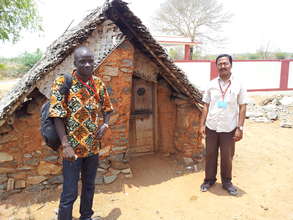 Our staff member in front of the patient hut