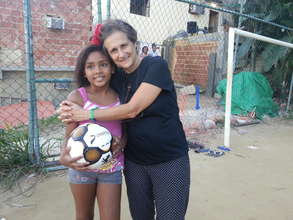 Young girls are tuned into football
