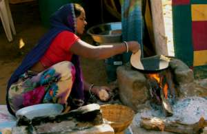 woman member of SHGs, making village style food