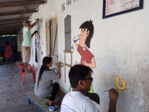 ECCA counselors painting hygiene messages