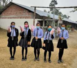 Students carrying pack of reusable sanitary pads