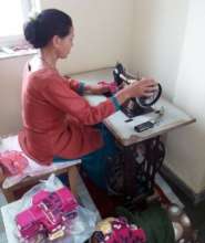 Stitching of sanitary napkin in progress