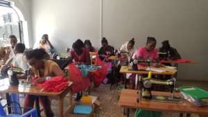Tailoring students, busy with their assignments.