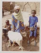 Babita Ouedraogo with her grandmother and her lamb