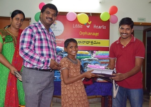 The Director distributed School needs to children