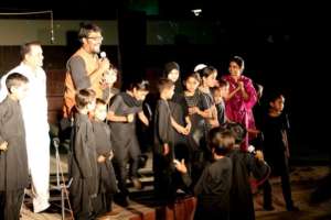 Teach For India Fellow with the students on stage