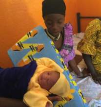 A proud new mom with her Gold Star fabric