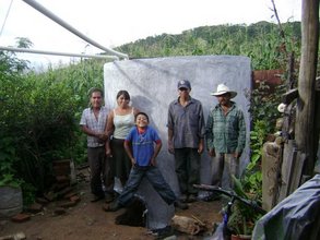 The Aragon Rios family proudly standing next to the completed ci