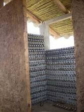 Reusing platic bottles to build walls of a composting toilet mod