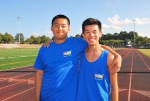 William and Kenny coach kids at YES Track & Field