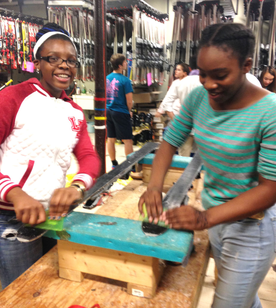 Junior Volunteers learn how to wax and tune skis