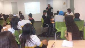 Explaining their solutions at program's journ end