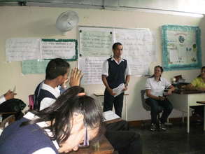 A young men presenting his remarks to the class