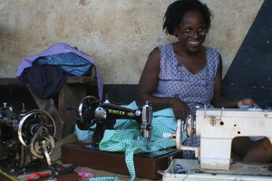 Jane busy handcranking out a child's dress.