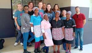 The Guesthouse staff with guests