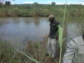 Thokozane checking crawfish traps in the Mbuluzi