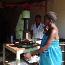 Girls using the hand press