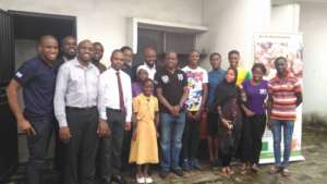 Damilola and his friends and family with the kids