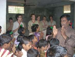 The french scout boys worship with the children