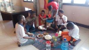 Some LGBTQ youth sharing a traditional meal
