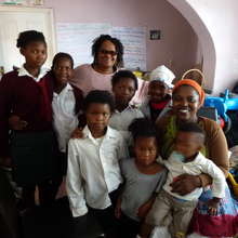 Ndileka and some of the children at Siyaphambili