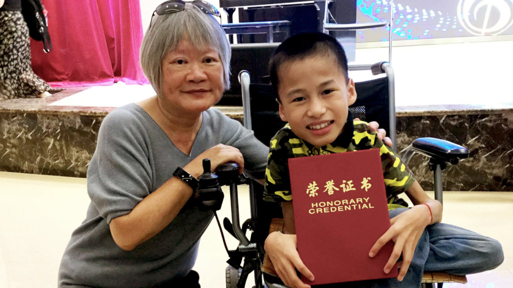 Student and teacher share a moment.