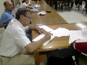 Mr. René Laffite, Chairman of FUCSA, signing.