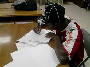 Mr. Olvin Cayetano, President of APROCUS, signing.