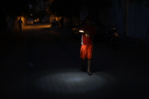 Little Sun:  a child's only light on a dark street