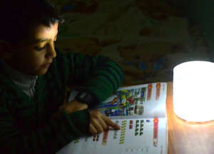 Ameer's nephew: homework w Luci Light in Gaza City