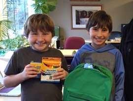 Jake and Ryder helped raise 100 backpack kits!