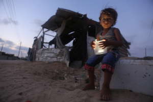 Light & Child in Front of Shack