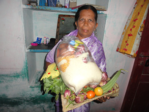 Destitute elder woman with monthly groceries