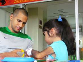 Juliana and father making craft