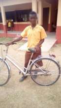 Roland with his bicycle in school