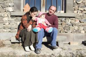 The family winter sunbathing outside the studio