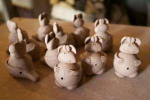 Monkey whistles drying before firing