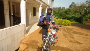 Dr. Tembon with one motor bike taking off for Aboh