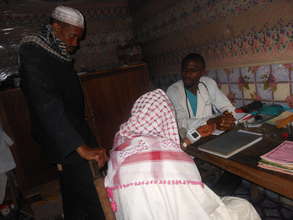Dr. Tembon With Fulani Community Patients