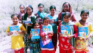 Smiling Slum Children with Education Stuff