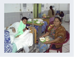 Gregorio after surgery, with his mother Dona