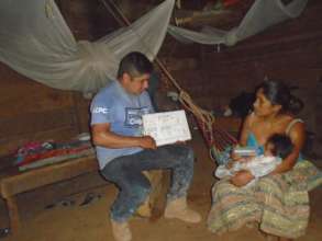 Julio Sel, health promoter, sharing information