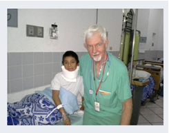 Gregorio after surgery, with volunteer surgeon