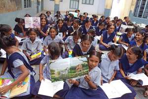 Orphanage children show their new library books