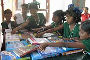 Children choosing library books to read