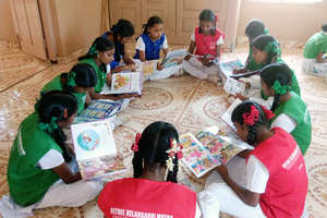 Orphanage girls engrossed in their library books