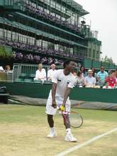 Hassan serves at Wimbledon