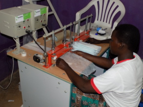 Young girls making the lucky girl pads to support