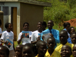 Young girls making sanitary pads for school girls