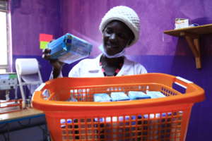Young girls making sanitary pads for school girls